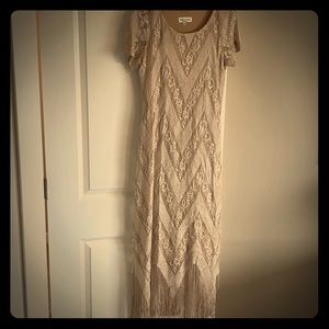 Dress in a beautiful crochet and fringe